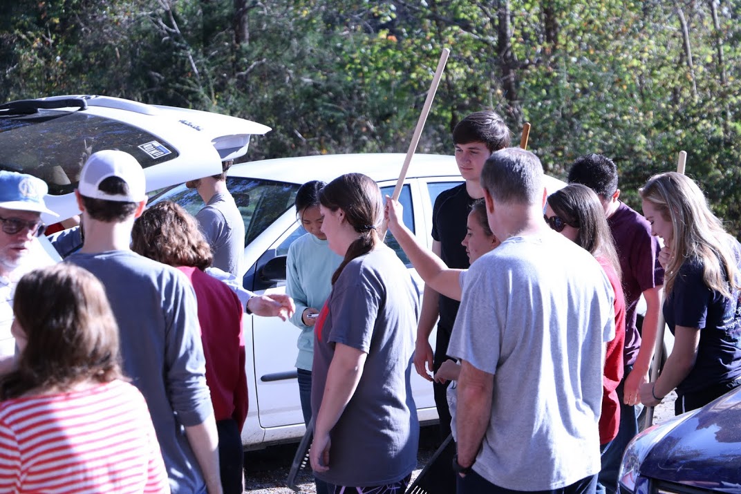 Participants in the history department's community service project at Salem Cemetery on November 1, 2016, get their work assignments and tools. Photo by Elizabeth Wilson
