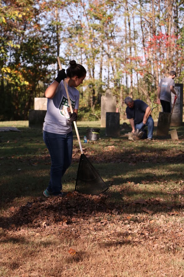 Joanna Butcher rakes leaves at Salem Cemetery as a part of the Phi Alpha Theta/History Department community service project on November 1, 2016. Photo by Elizabeth Wilson