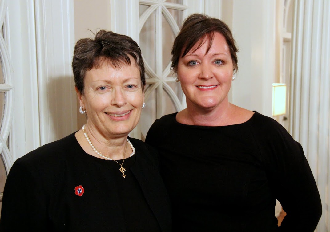 Dr. Alice-Catherine Carls (left), a Tennessee Great War Commissioner and the coordinator of the 2016 Great War Symposium, stands with Tammy Buchanan, an administrative assistant at the City of Jackson mayor's office, during a reception in the Memorial Hall of Jackson's First Presbyterian Church on November 4, 2016.