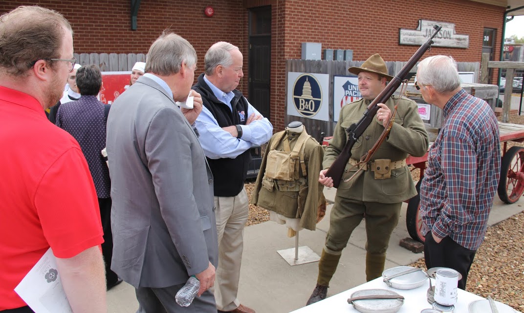 Great War Symposium attendees listen to Tim Poole (wearing the World War I US military uniform), Manager of Pinson Mounds State Archaeological Park, talk about a World War I rifle during a living history event on November 5, 2016.