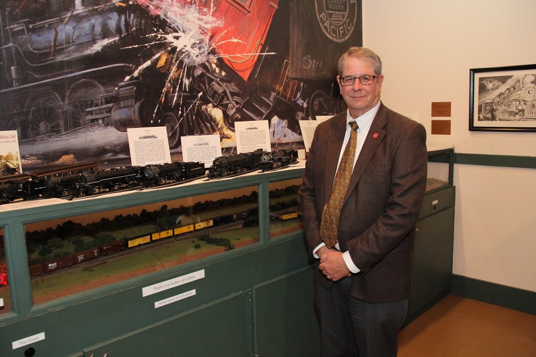 Tennessee Great War Commissioner Richard Gonzales stands with model trains representing the World War I era that he provided for a display at Jackson's Casey Jones Railroad Museum on November 5, 2016.