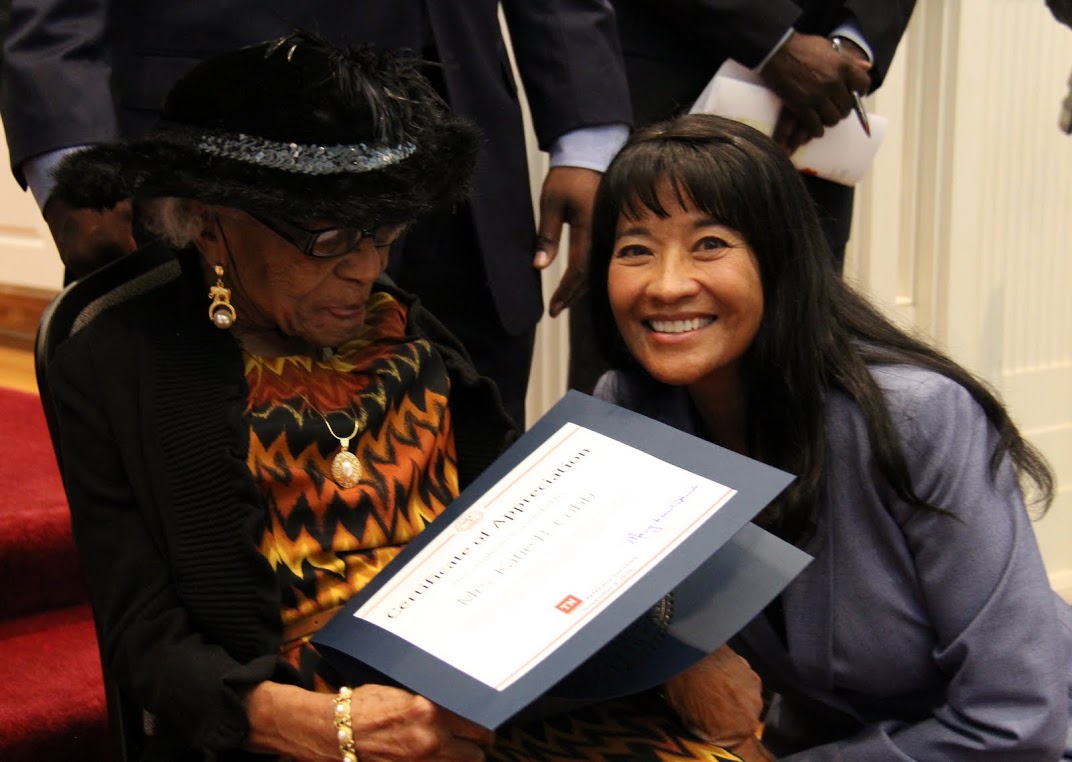 Many-Bears Grinder (right), the Tennessee Department of Veterans Services Commissioner, presents a certificate of appreciation to Mrs. Katie Cobb, one of the few remaining widows of World War I veterans living in the United States, during a World War I commemoration program that the Tennessee Great War Commission sponsored at First Presbyterian Church in Jackson on November 4, 2016.