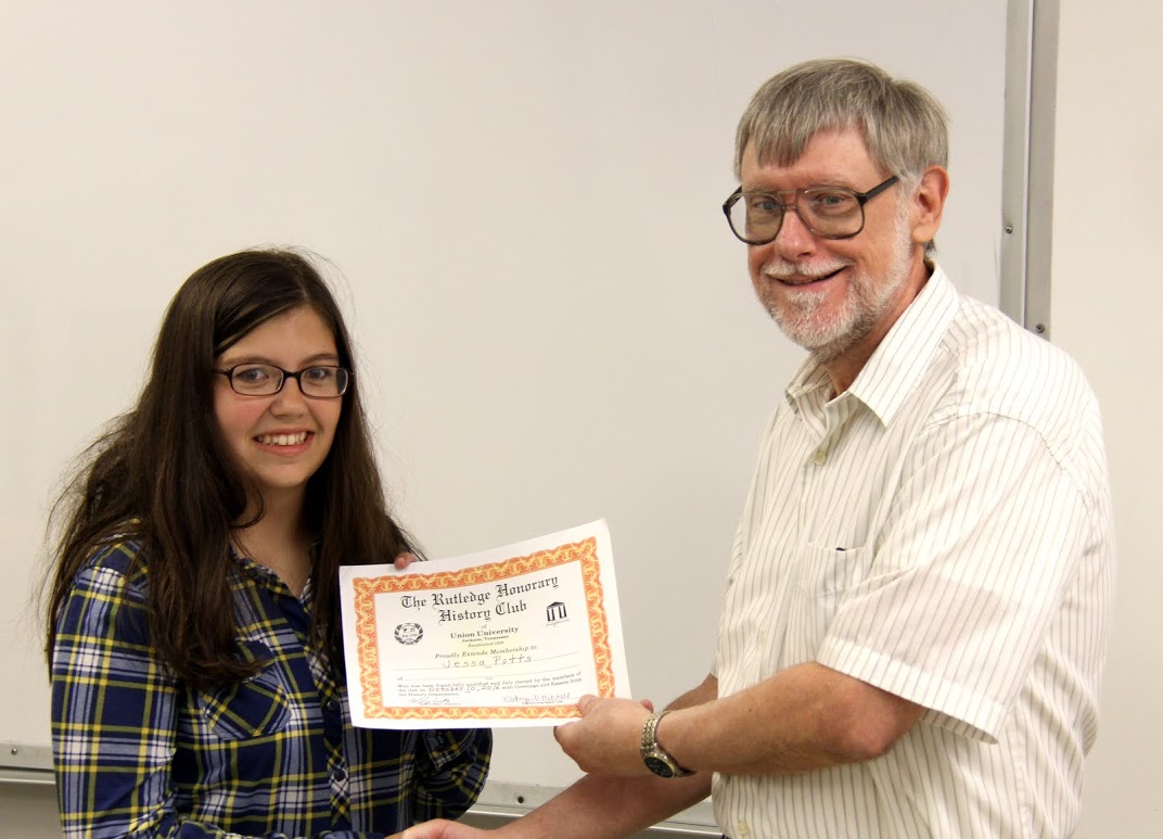 Jessa Potts receives her history club certificate of membership from Dr. Terry Lindley on October 10, 2016.