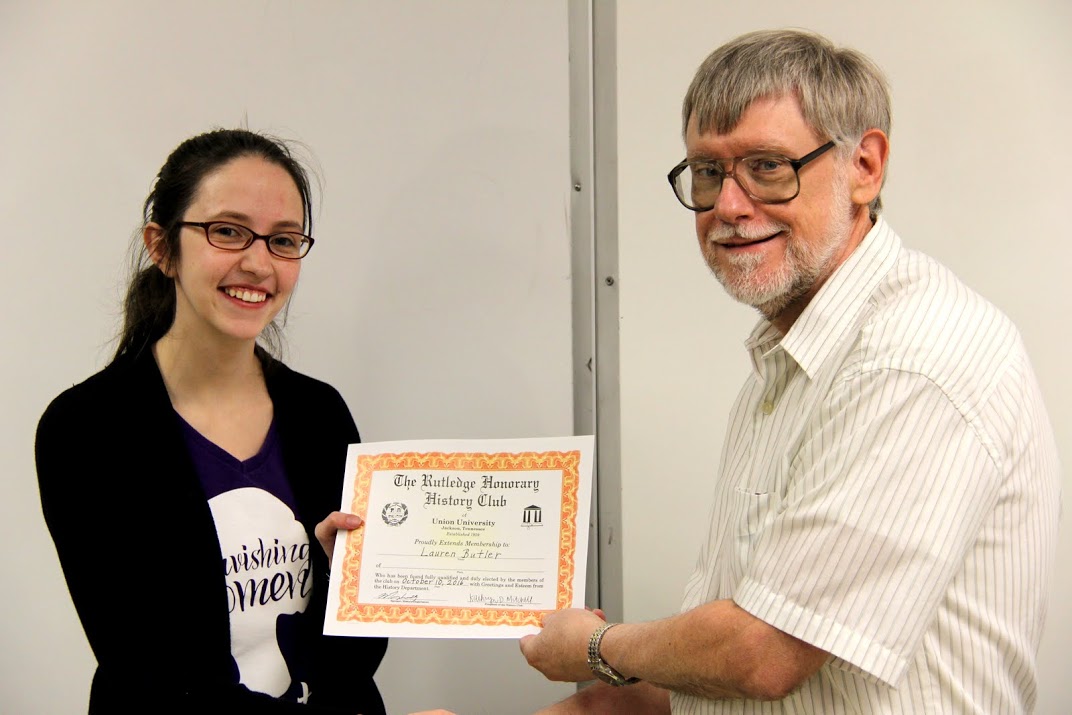 Dr. Terry Lindley congratulates Lauren Butler on her membership in the Rutledge Honorary History Club on October 10, 2016.