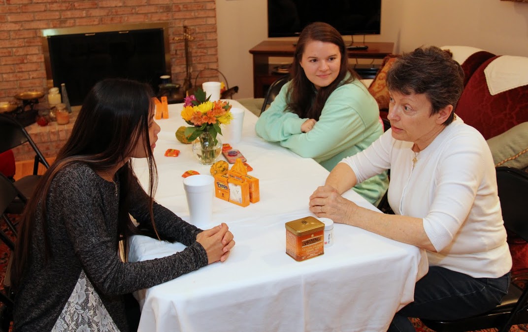 Dr. Alice-Catherine Carls (right) talks with Katherine Cheshire (left) and Jordan Sellers during the Phi Alpha Theta Best Chapter Award pizza party on October 21, 2016.