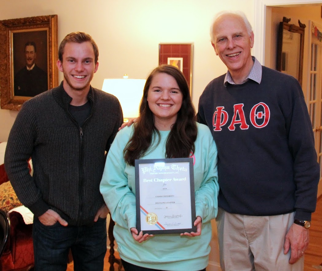 Delta-Psi Chapter President Jordan Sellers holds the 2016 Phi Alpha Theta Best Chapter Award certificate as she stands between Delta-Psi Secretary Seth Reid (left) and Dr. Stephen Carls, the chapter's faculty advisor.