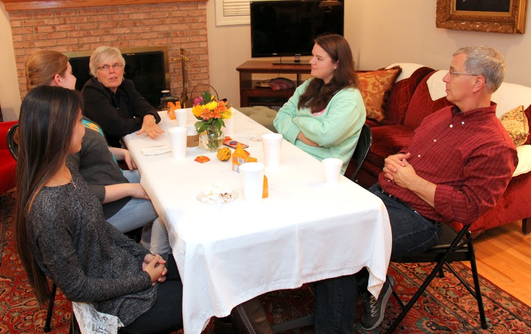 Attendees at the Phi Alpha Theta Best Chapter Award pizza party on October 21, 2016, have a relaxed conversation together. They are (starting on the left and going clockwise) Katherine Cheshire, Susannah Murphine, Nancy Thomas, Jordan Sellers, and Dr. David Thomas.