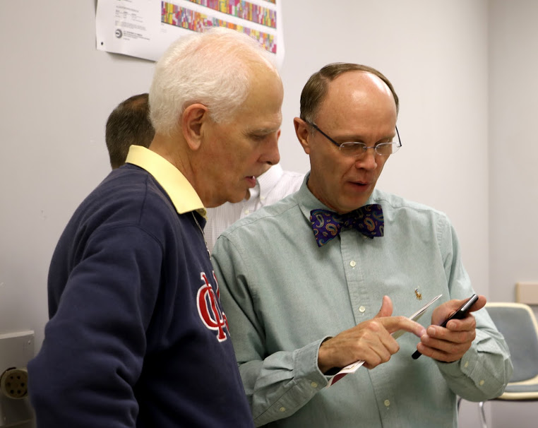 Robert Briley (right) shows Dr. Stephen Carls an Instagram photo that he took during the Phi Alpha Theta plenary meeting on September 13, 2016. Photo by Elizabeth Wilson