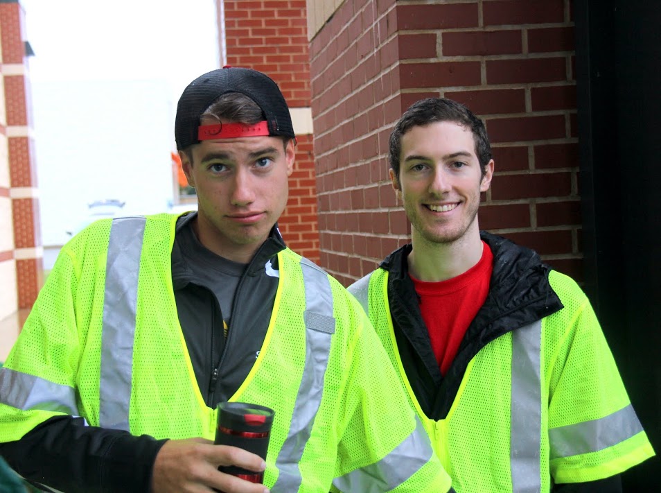 Phi Alpha Theta members Stephen Lewoczko (left) and Luke Adkins wait for their volunteer assignments at the Racing So They Can Ride event on September 17, 2016.