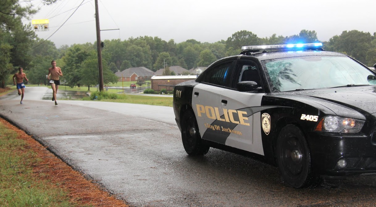 A Jackson police department vehicle paves the way for the lead runners in the Racing So They Can Ride event on September 17, 2016.