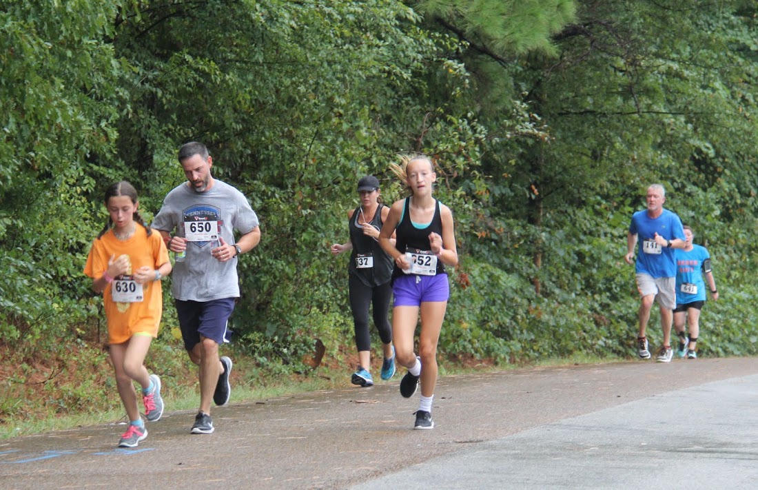 Participants in the Racing So They Can Ride 5k reach the three-quarters mark of the race on September 17, 2016.