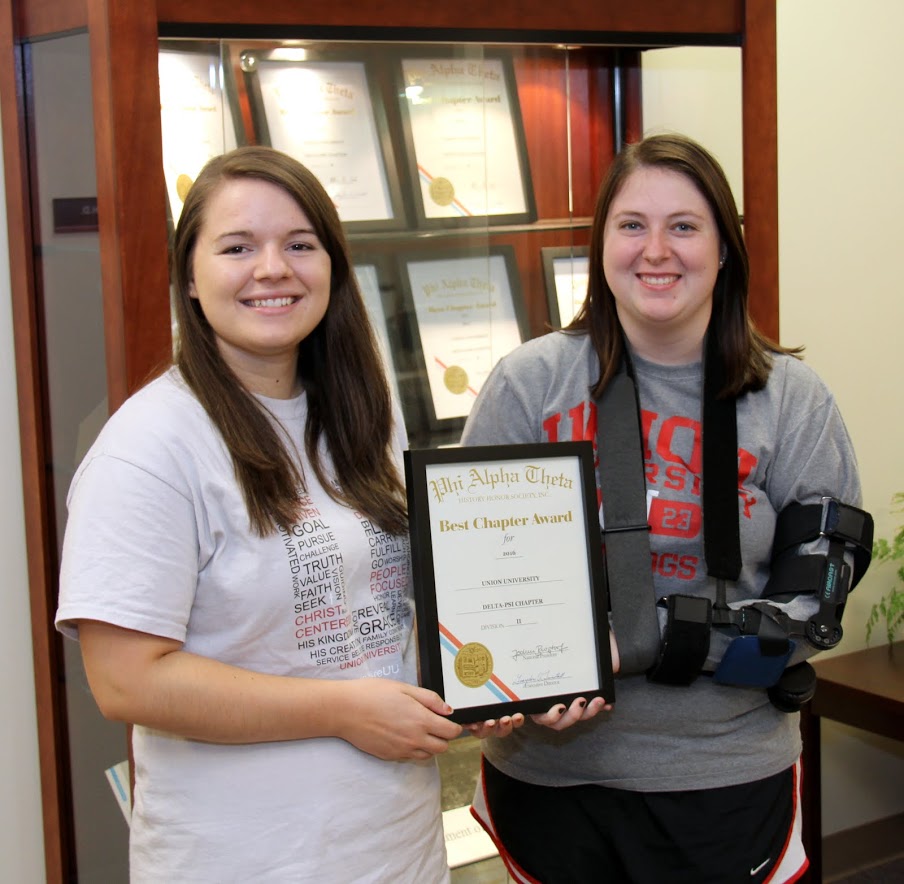 Delta-Psi President Jordan Sellers (left) and Vice President Kathryn Mitchell hold the 2016 Phi Alpha Theta Best Chapter Award certificate that arrived in the mail on September 26, 2016.