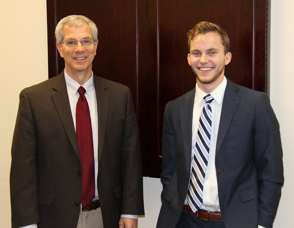 Dr. David Thomas (left) and Seth Reid stand together prior to Reid's honors thesis defense on December 8, 2017.