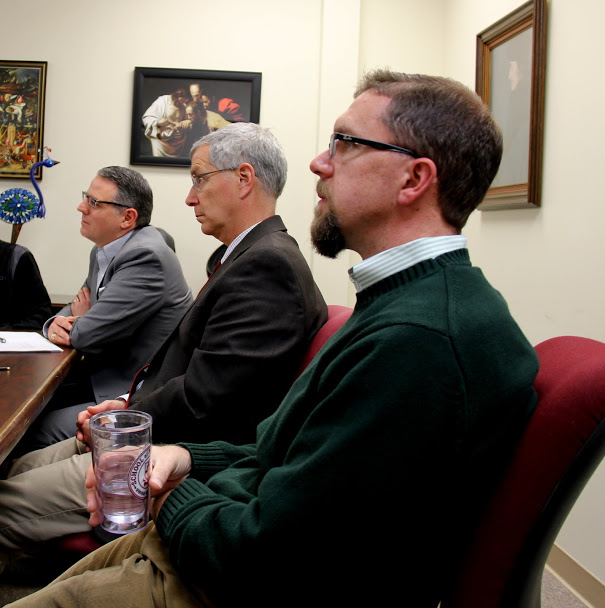 Seth Reid's thesis committee members listen to him answer a question during his thesis defense on December 8, 2017. They are (left to right) Dr. Keith Bates, Dr. David Thomas, and Dr. Justin Barnard.