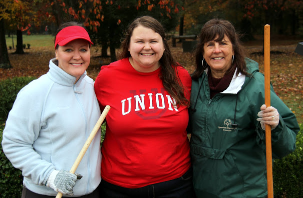 Tammy Buchanan-Anderson (left to right), Jessica Barton, and Jodi Jacobs stand together at Liberty Garden Park during the History Department/Phi Alpha Theta community service project on November 7, 2017.