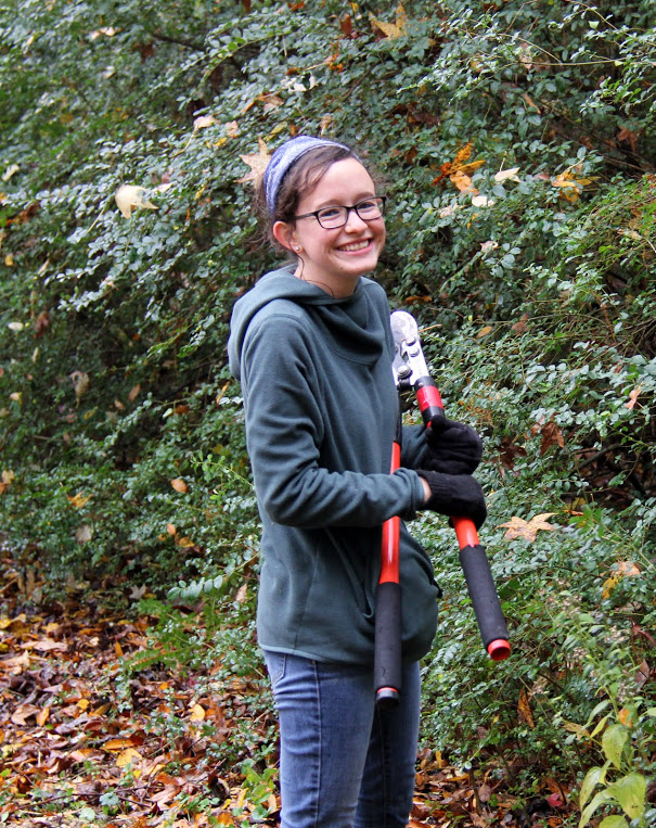 Lillie Salazar pauses for a photo while pruning shrubs at Liberty Garden Park on November 7, 2017.