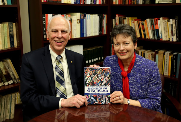 Drs. Stephen and Alice-Catherine Carls hold a copy of the book that they coauthored and that Routledge released to the public on November 8, 2017. Photo by Kristi Woody