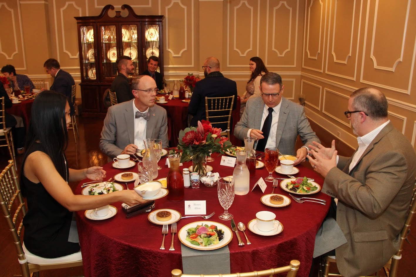 Attendees at the Carls-Schwerdfeger History Lectureship dinner in honor of Dr. Bruce Gordon prepare their salad plates while conversing. They are (left to right) Katherine Cheshire, Robert Briley, Dr. Keith Bates, and Dr. Nathan Finn.