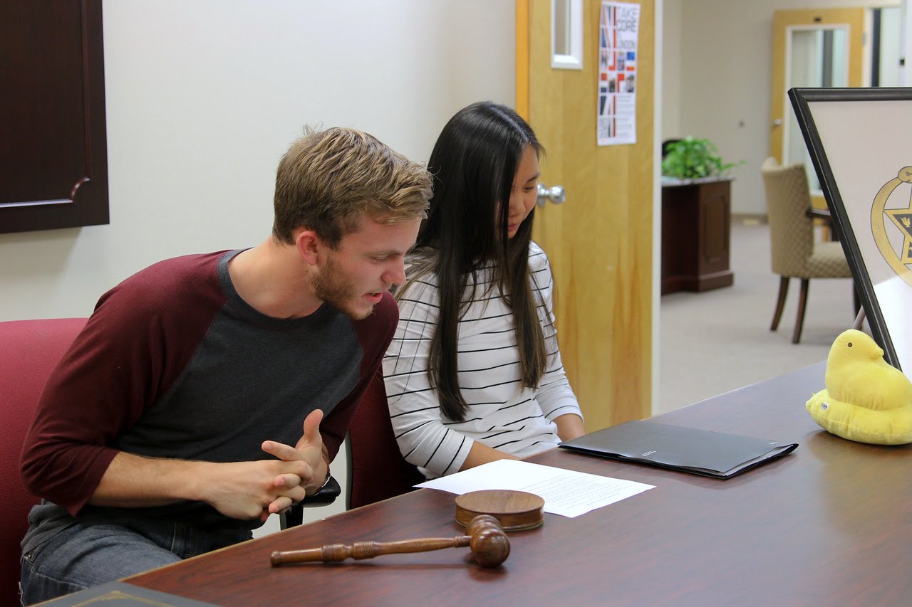 Delta-Psi President Seth Reid and Vice President Katherine Cheshire look over the agenda for the chapter's plenary meeting on September 14, 2017. Photo by Hannah Kate Heckart