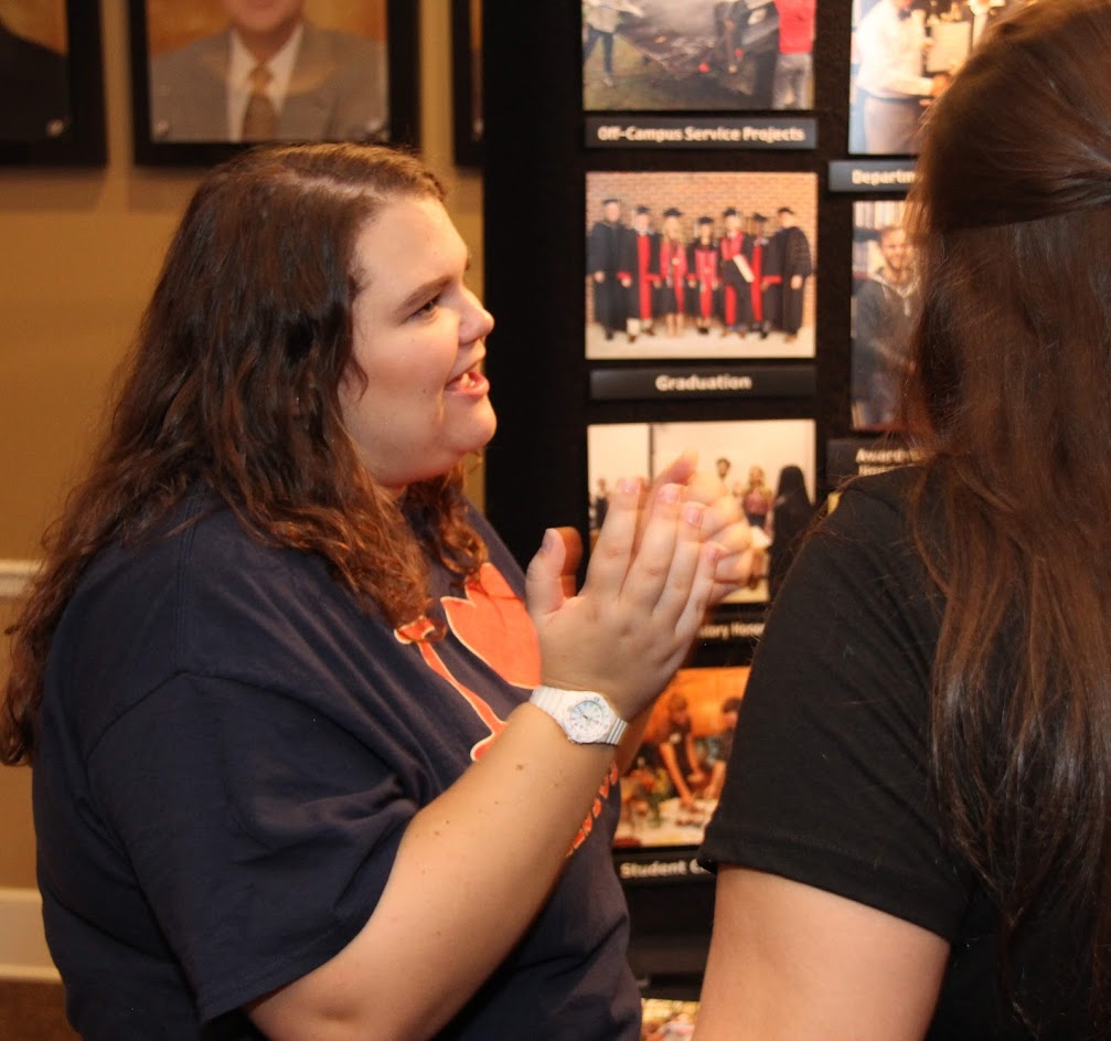 Rutledge Honorary History Club President Jessica Barton (left) talks with a student about the history department at the Campus Life Fair on August 19, 2018.