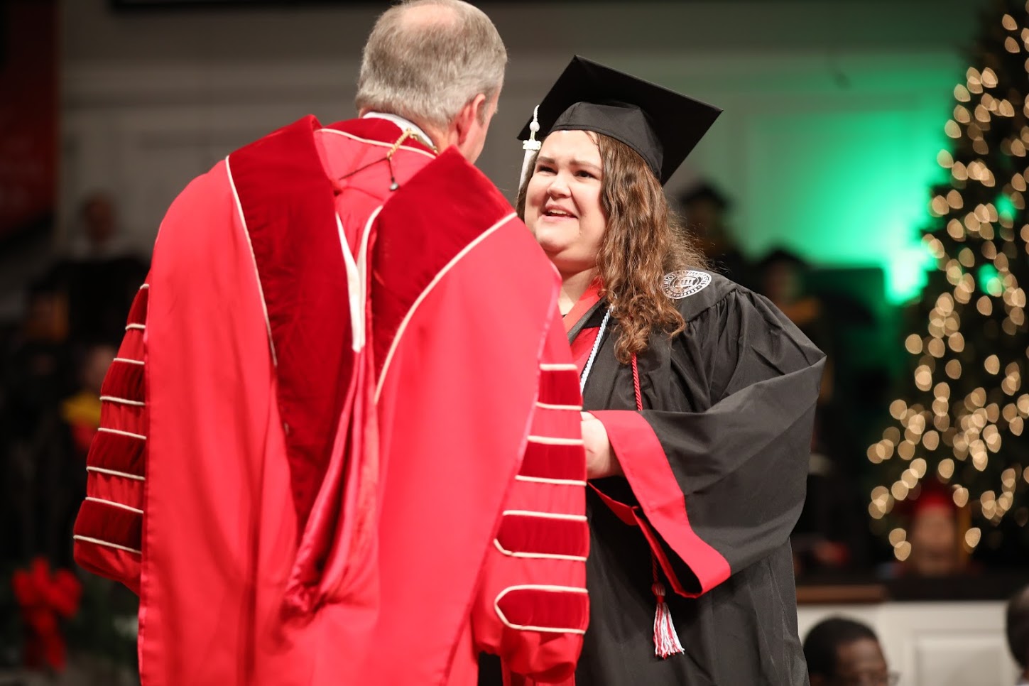 Phi Alpha Theta member Jessica Barton accepts her Union University diploma and congratulations from President Samuel W. Dub Oliver on December 15, 2018, for the completion of a Bachelor of Arts program with majors in intercultural studies and French. Photo by Kristi Woody