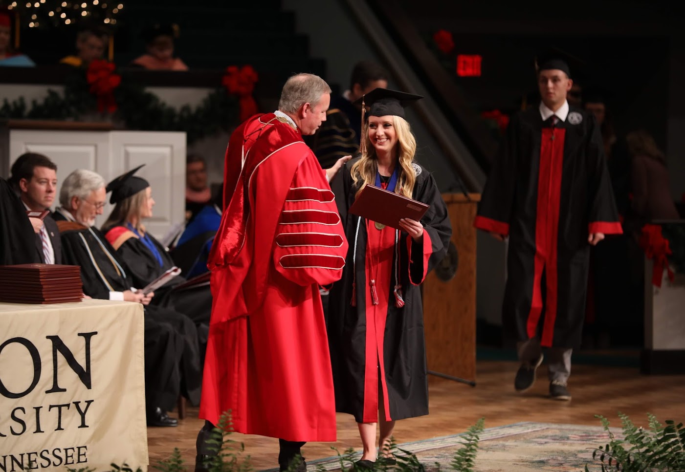Phi Alpha Theta member Nakota Wood accepts her diploma from Union University President Samuel W. Dub Oliver on December 15, 2018, for completing a Bachelor of Science program with a major in business administration. Photo by Kristi Woody