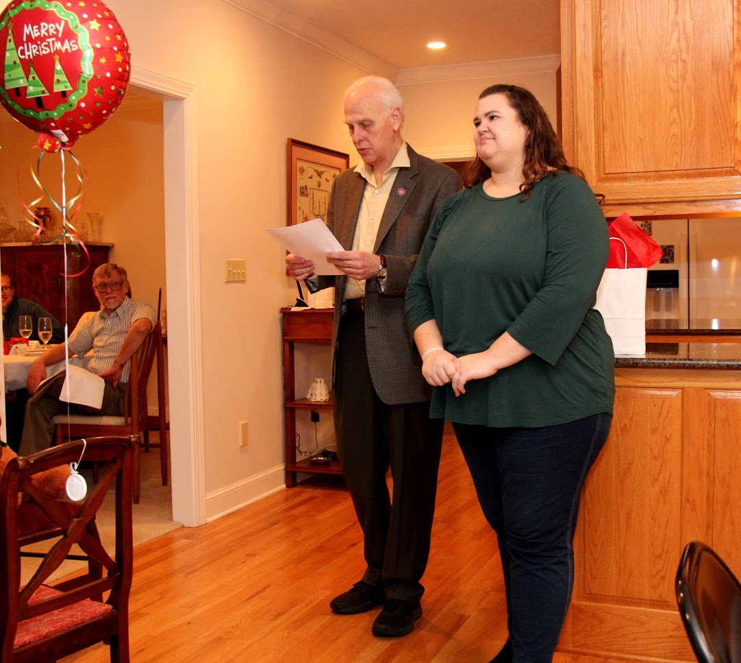 Dr. Stephen Carls recognizes Phi Alpha Theta member Jessica Barton as a graduating senior at the French Christmas dinner on December 8, 2018.