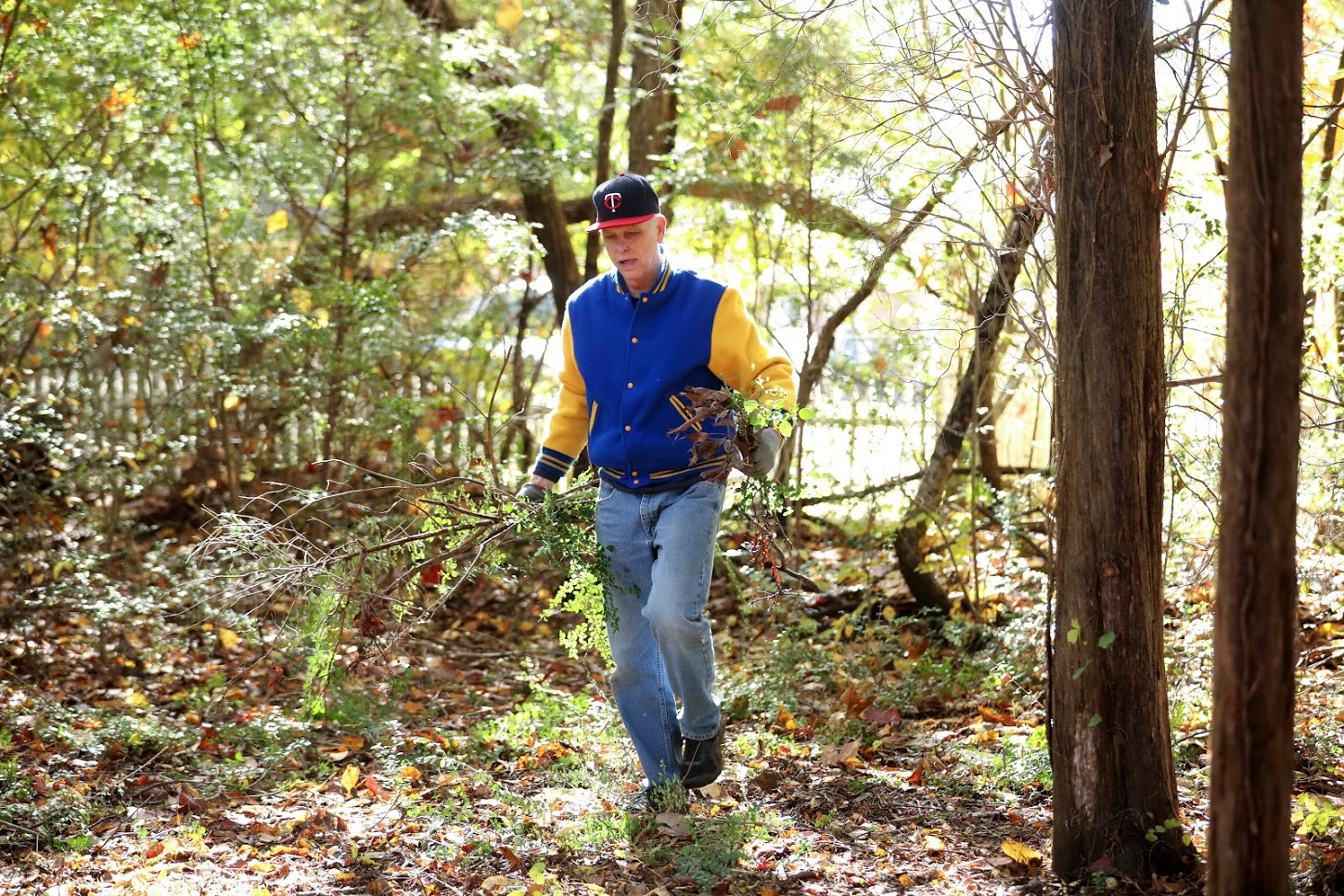 Dr. Stephen Carls removes branches from the small wooded area of Liberty Garden Park as part of the history department's community service project there on November 6, 2018. Photo by Kristi Woody