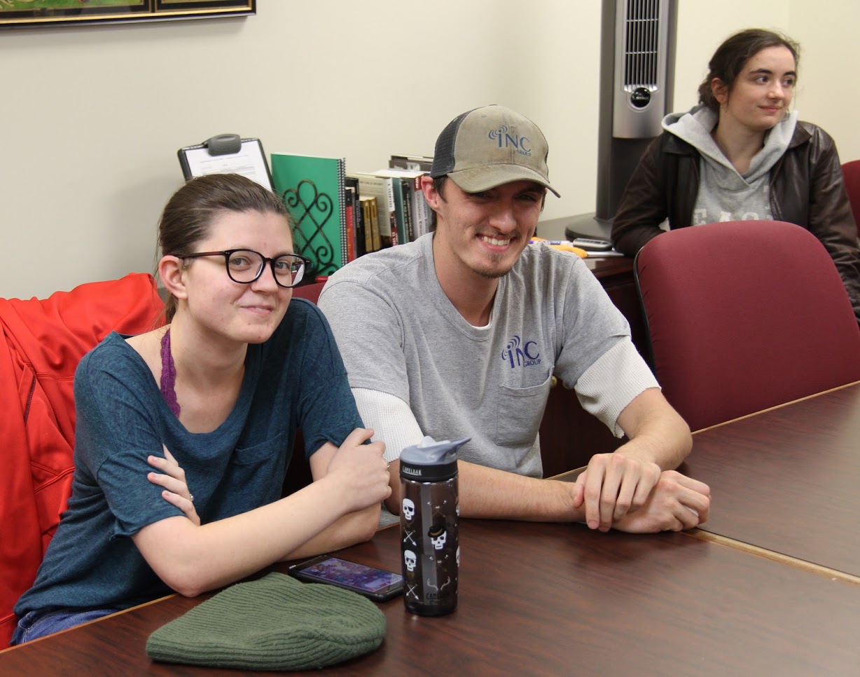 Attendees at the Rutledge Honorary History Club autumn movie night on November 9, 2018, wait for some pizza to arrive. They are (left to right) Emily Summers, Andrew Caldwell, and Leah Atkins.