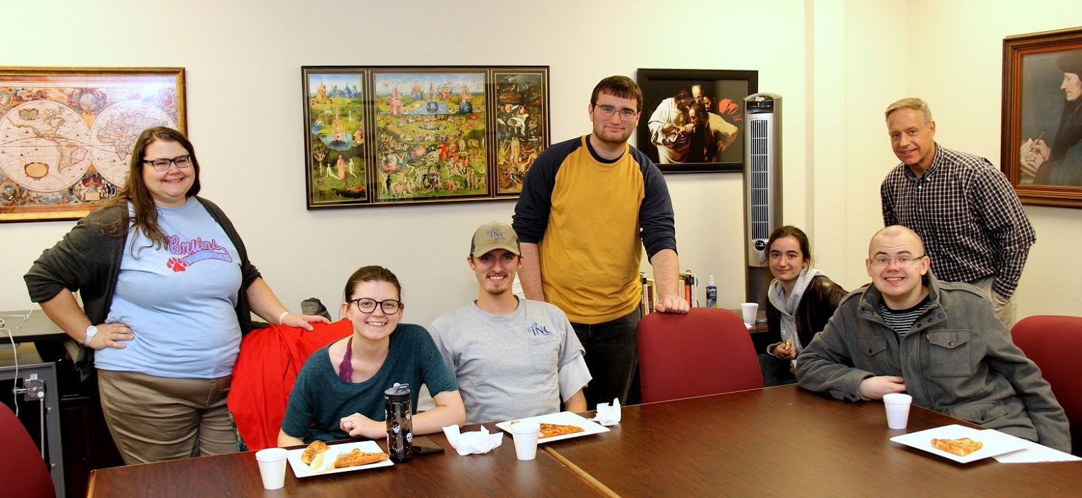 Attendees at the Rutledge Honorary History Club fall movie night pause for a photo before the start of the movie TORA! TORA! TORA! They are (seated, left to right) Emily Summers, Andrew Caldwell, Leah Atkins, and Will Choate; (standing, left to right) Jessica Barton, Miles Randall, and Dr. Henry Allen.