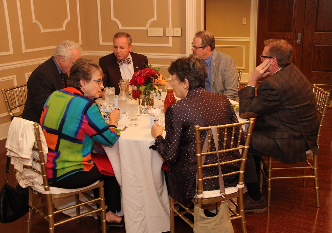 Attendees at the Carls-Schwerdfeger History Lectureship dinner in honor of Dr. Melvyn Leffler on October 22, 2018, enjoy food and fellowship together. They are (starting on the front left and going clockwise) Drs. Phyllis Leffler, Melvyn Leffler (face partially obscured), Samuel W. 