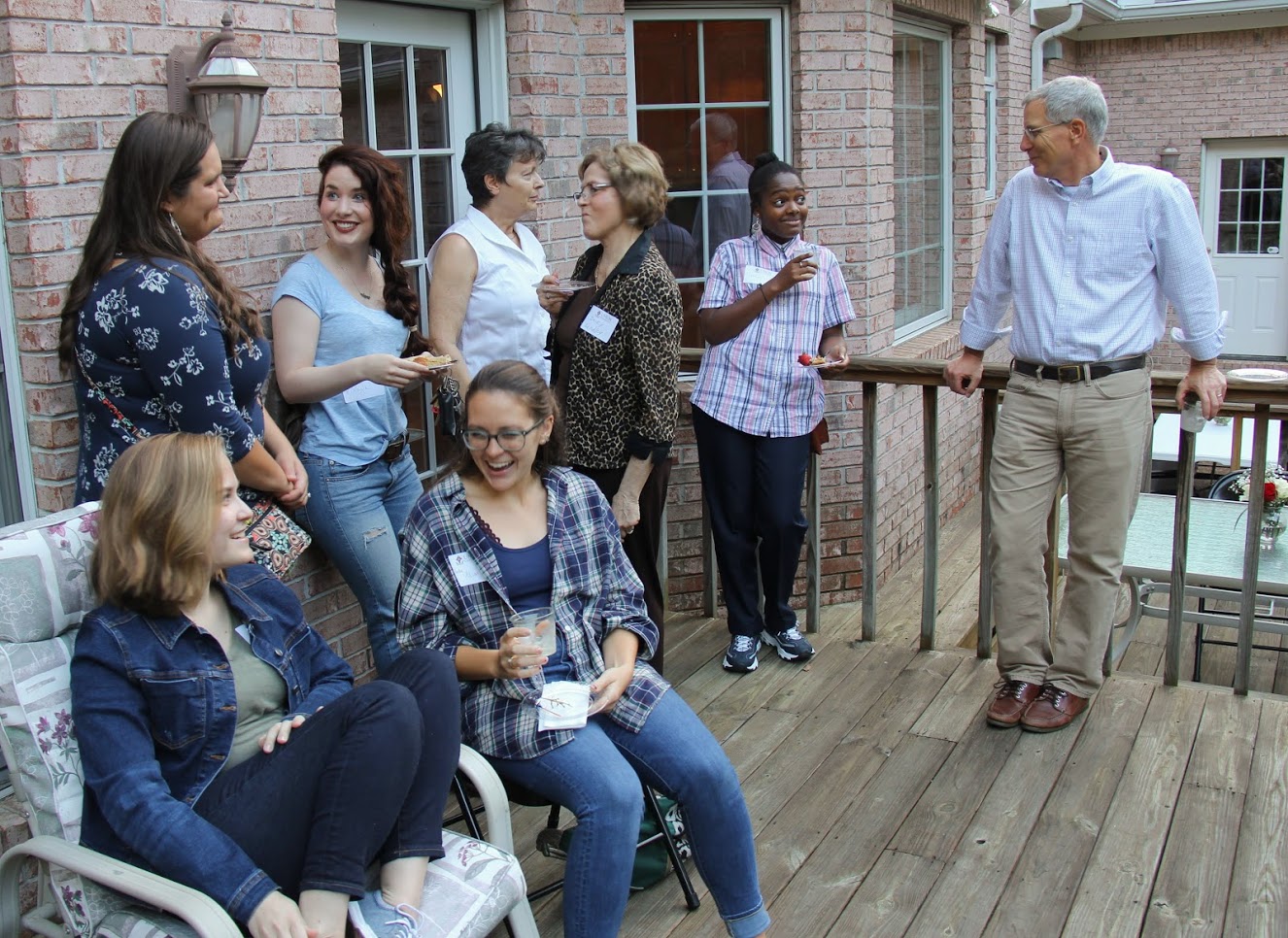 Attendees at the History Welcome Reception on September 10, 2018, engage in conversation while enjoying the weather and snacks. They are: (seated) Megan Ledbetter and Katie Allison; (standing, left to right) Sandra Allen, Mikayla Simpson, Dr. Alice-Catherine Carls, Becky Lindley, Tranae Newsome, and Dr. David Thomas.