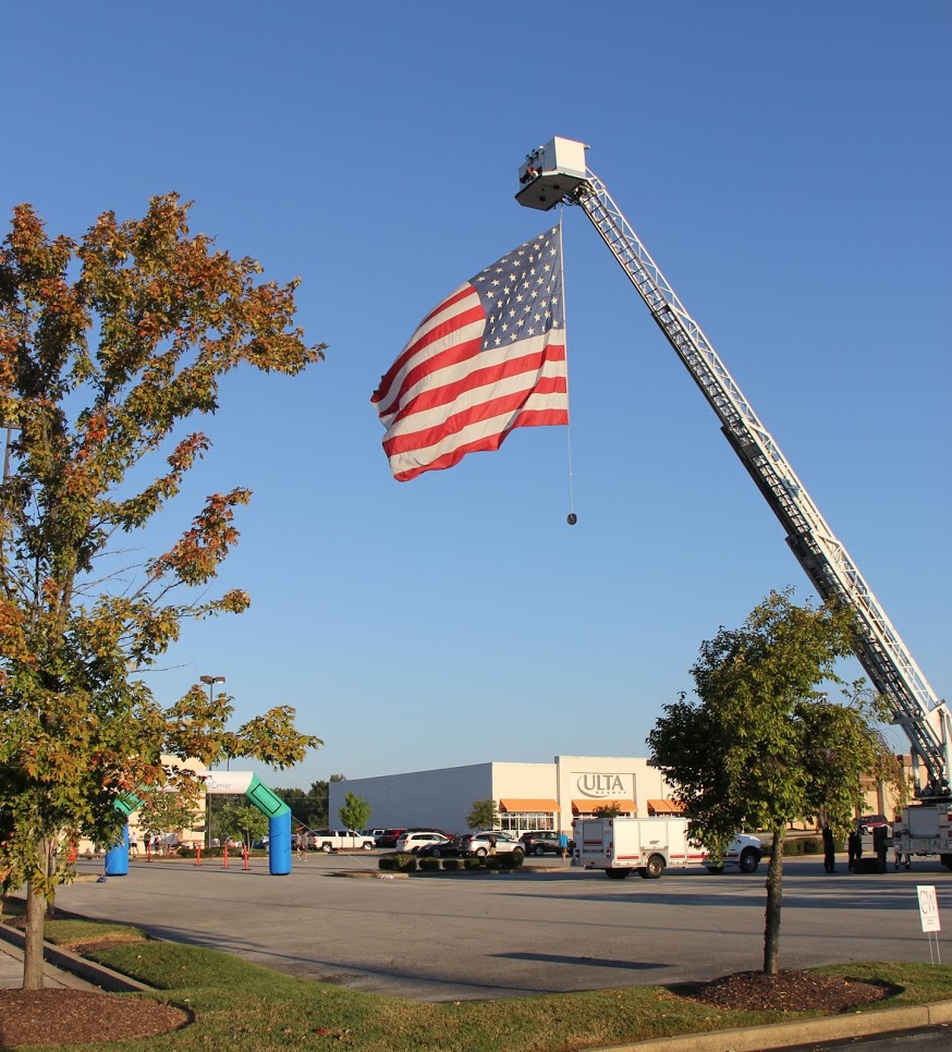 An American flag highlights the starting and finishing points of the Racing So They Can Ride 5k and 10k races on September 15, 2018.