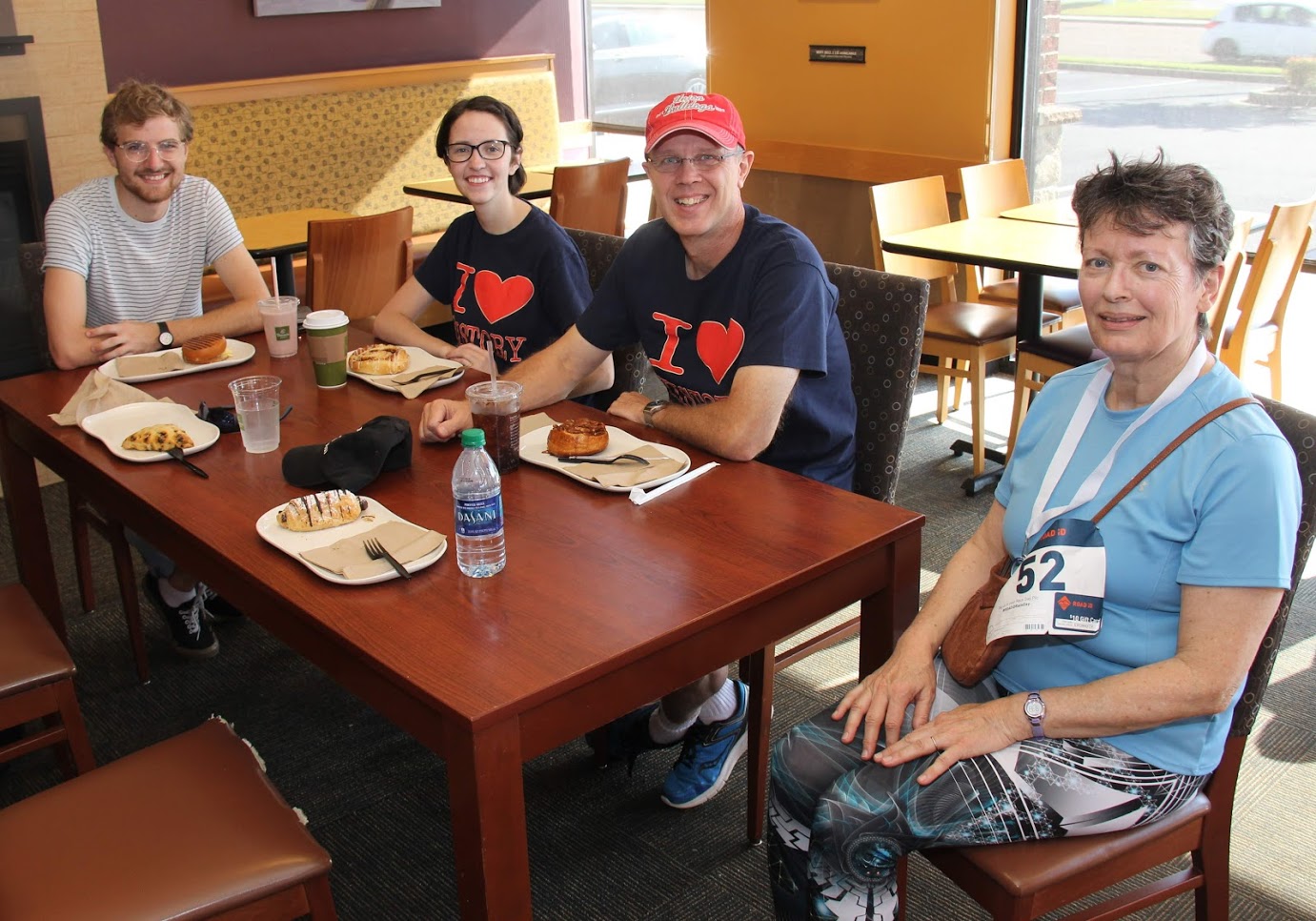 Phi Alpha Theta participants at the Racing So They Can Ride event join together for breakfast at Panera Bread following the races on September 15, 2018. They are (left to right) Luke Sower, Lauren Butler, Robert Briley, and Dr. Alice-Catherine Carls.