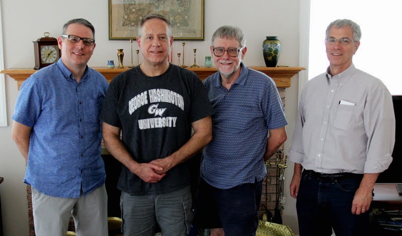 Drs. Keith Bates (left to right), Henry Allen, Terry Lindley, and David Thomas join together for a photo at Dr. Stephen Carls's home during a department working lunch on August 12, 2019.
