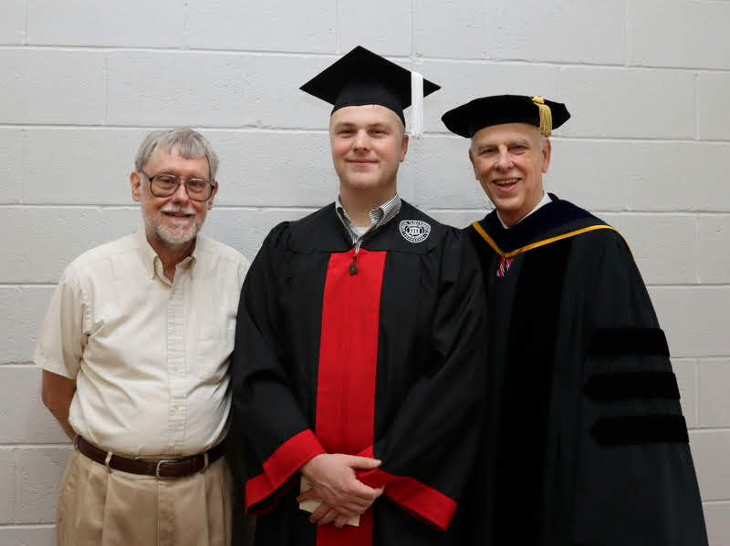 Graduating history major Nathan Van Neste stands with Dr. Terry Lindley (left) and Dr. Stephen Carls (right) prior to Union's undergraduate commencement service on December 14, 2019.