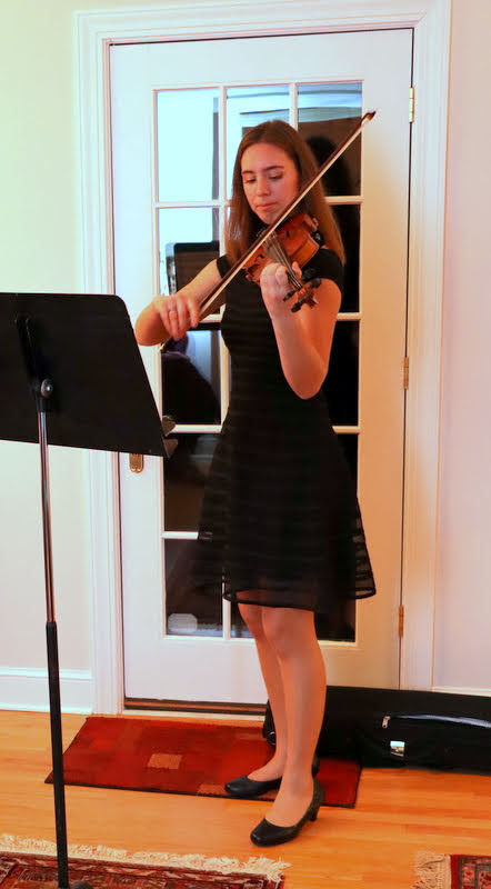 Emma Otto plays a Christmas piece on her violin at the Phi Alpha Theta/History Department Christmas Dinner on December 7, 2019.