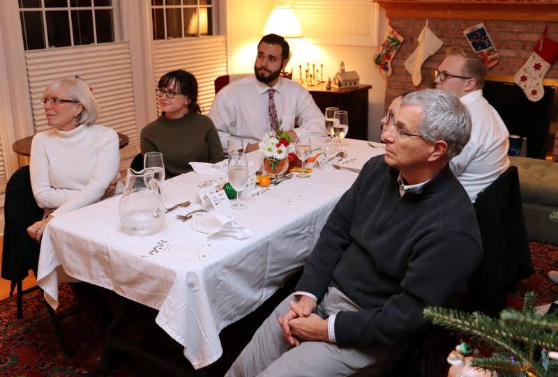 Attendees at the French Christmas dinner on December 7, 2019, listen to Emma Otto perform on the violin. They are (starting on the left and going clockwise) Nancy Thomas, Lillie Salazar, Nicholas Terra, Nathan Heatherly, Katie Allison, and Dr. David Thomas.
