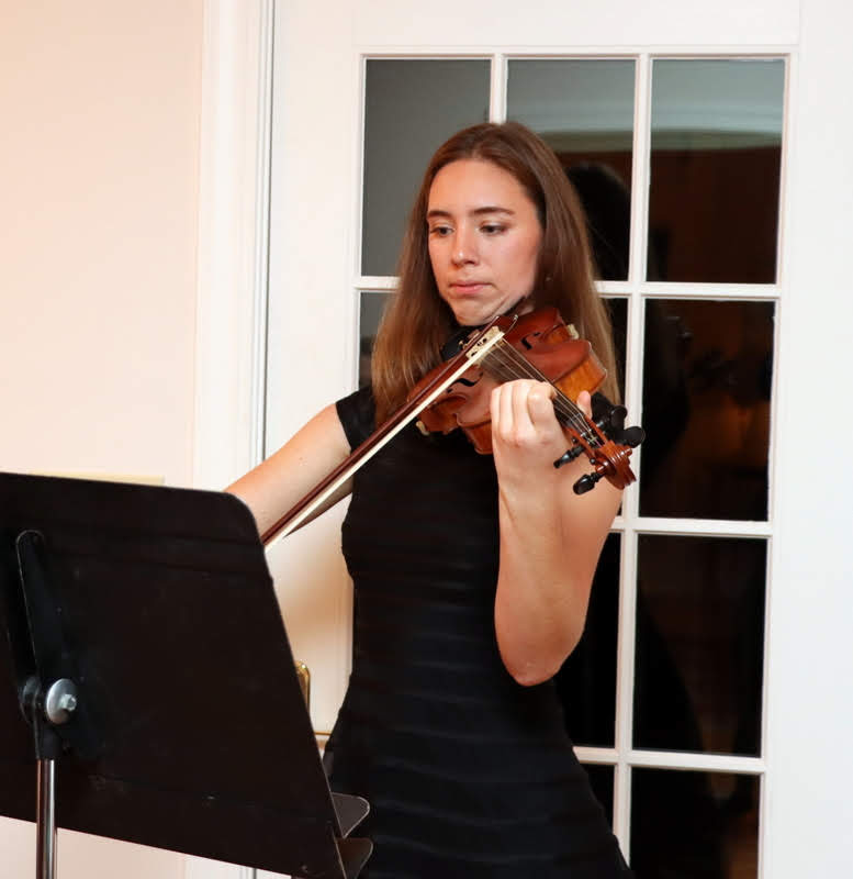Emma Otto, a music education major at Union, plays a violin solo at the Phi Alpha Theta French Christmas dinner on December 7, 2019.