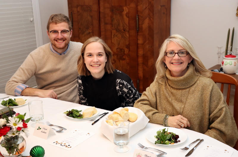 Luke Sower (left to right), Megan Ledbetter, and Brenda Briley pause for a photo at the Phi Alpha Theta/History Department French Christmas Dinner on December 7, 2019.