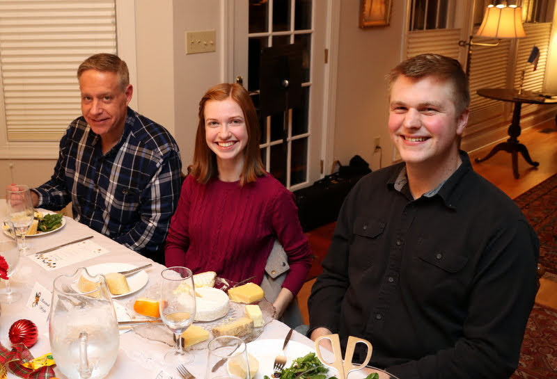 Dr. Henry Allen (left to right), Savannah Wright, and Nathan Van Neste enjoy their salad and cheese course at the French Christmas dinner on December 7, 2019.