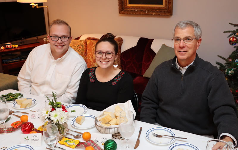 Nathan Heatherly (left to right), Katie Allison, and Dr. David Thomas take time for a photo at the French Christmas dinner on December 7, 2019.