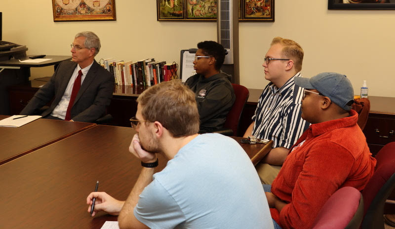 Attendees listen to Katie Allison  deliver an abridged version of her honors thesis about Biblical Feminism: An Oxymoron? on December 9, 2019. They are (starting on the left and going clockwise) Dr. David Thomas, Daisha Jiles,   Nathan Heatherly, Ashley Akerson, and Luke Sower.