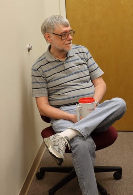 Dr. Terry Lindley listens to Leah Atkins talk about her honors thesis at her thesis defense on December 9, 2019.