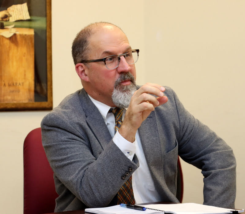 Honors thesis committee member Dr. Scott Huelin asks a question of Leah Atkins at her thesis defense on December 9, 2019.