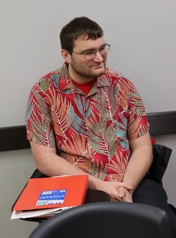 History club member Miles Randall shows his approval for the date of the club's fall pizza party/movie night during the fall plenary meeting on November 11, 2019.