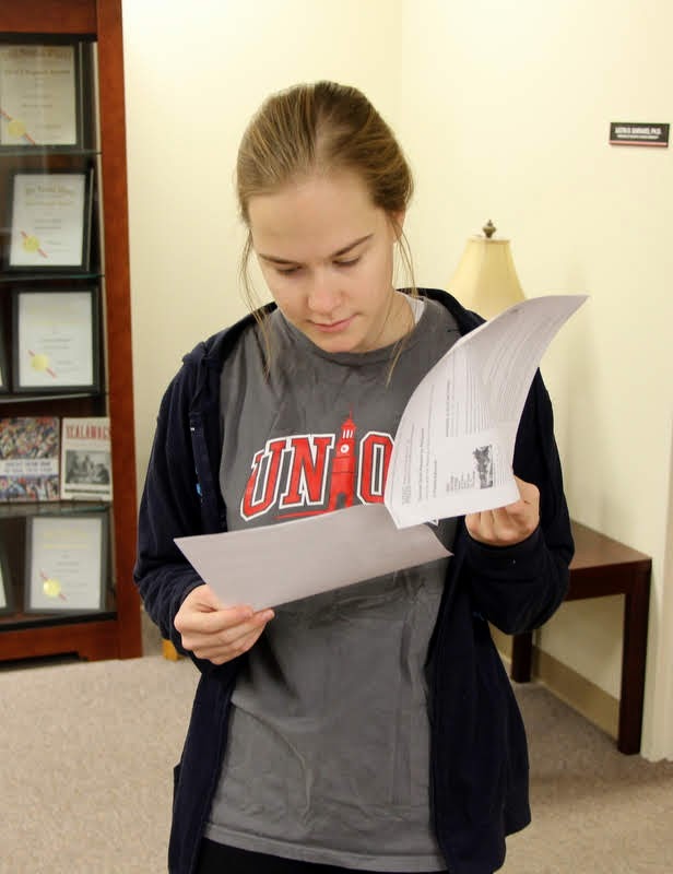 Phi Alpha Theta Vice President Megan Ledbetter looks at information on recently published history books on October 29, 2019, as she decides what books she would like to see Union's library purchase with the Phi Alpha Theta Best Chapter Award prize money.