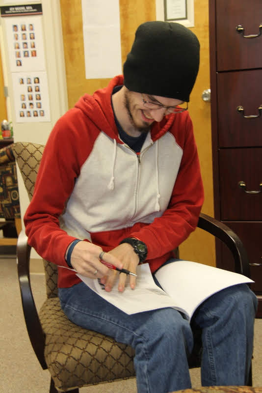 Phi Alpha Theta member Matthew Latham goes through book publishers' materials on October 29, 2019, as he selects history books he would like to see added to Union's library with the Delta-Psi chapter's Best Chapter Award prize money.
