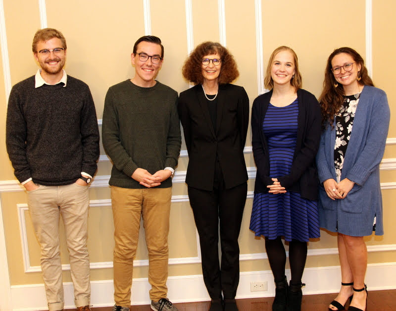 Dr. Joan Waugh (center) stands with Phi Alpha Theta officers at the end of a dinner in her honor on October 21, 2019. The officers are (left to right) Luke Sower (president), Mac Hazlerig (SGA senator), Megan Ledbetter (vice president), and Katie Allison (SGA senator).