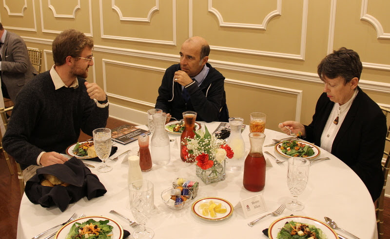 Luke Sower (left) talks to Dr. Michael La Rosa of Rhodes College about Latin American history at the dinner in honor of Dr. Joan Waugh of UCLA on October 21, 2019. Dr. Alice-Catherine Carls is at the right.